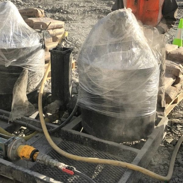 A Grout Pump & Mixer Pneumatic system, still in protective wrap from being transported from Grout Pump Hire's workshop to the work site.