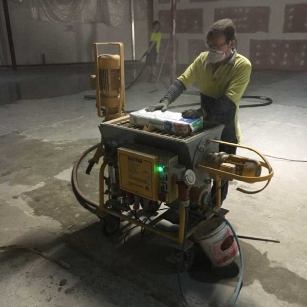 Grout Pump Continuous Rental Grout Pump in use for floor spraying. Perth