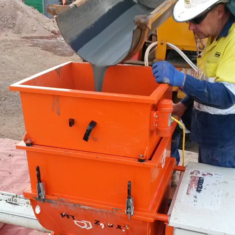 Concrete pouring into grout agitator pump, part of our Grout Agitator rental range Perth