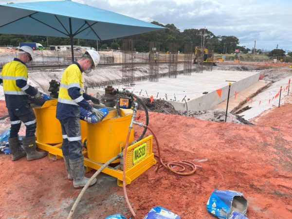 The team from Grout Pump Hire Perth on a road construction work site in regional WA, using their twin grout pump system to complete contracted work.