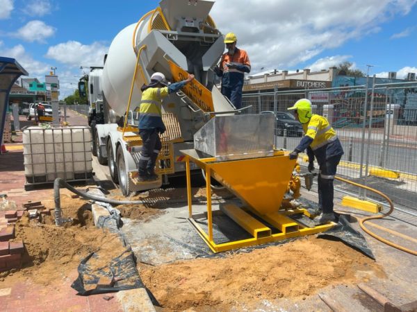 The expert team from Grout Pump Hire Perth, on a contracted metro work site with the required grout pump system to complete the work required on the roadside.