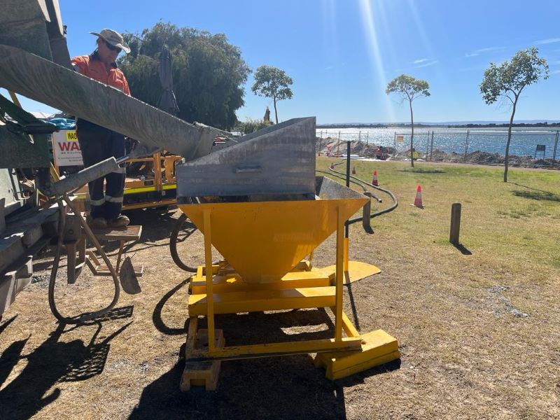 Grout pump on active construction site with Grout Pump Hire Perth's contractor team.