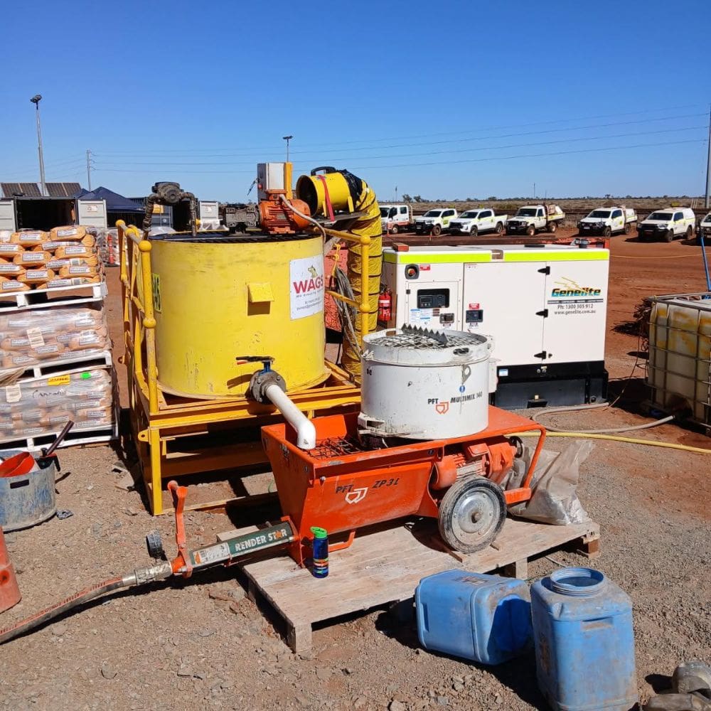 WAGS 1000 litre poly mixing system with connected grout pump operating onsite.